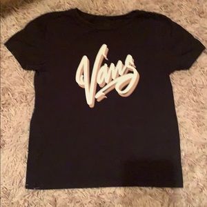 black shirt, vans logo written in pink and white
